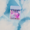 wakse Cosmic Candy sticks with a packet of cotton candy on a light blue background