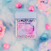 Cosmic Candy product with colorful candies and lollipops on a soft, cloud-like background