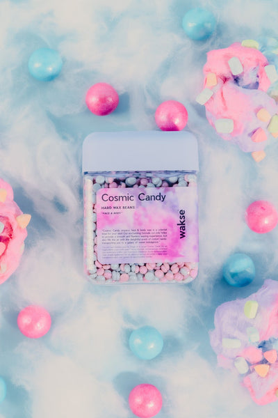 Cosmic Candy product with colorful candies and lollipops on a soft, cloud-like background