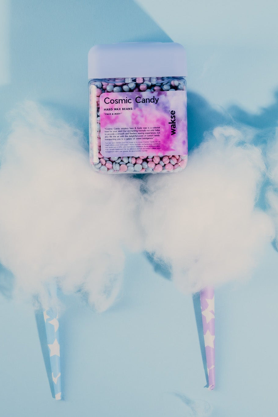 wakse Cosmic Candy with a container labeled 'Cotton Candy' on a light blue background