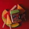 waksewatermelon slices and popsicle sticks on a red background