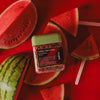 wakse Watermelon-themed wax beans with watermelon slices on a red background
