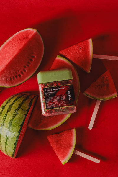 wakse Watermelon-themed wax beans with watermelon slices on a red background