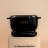 Black electric wax warmer for hard wax by My Store sitting on a white box with hair removal slogan