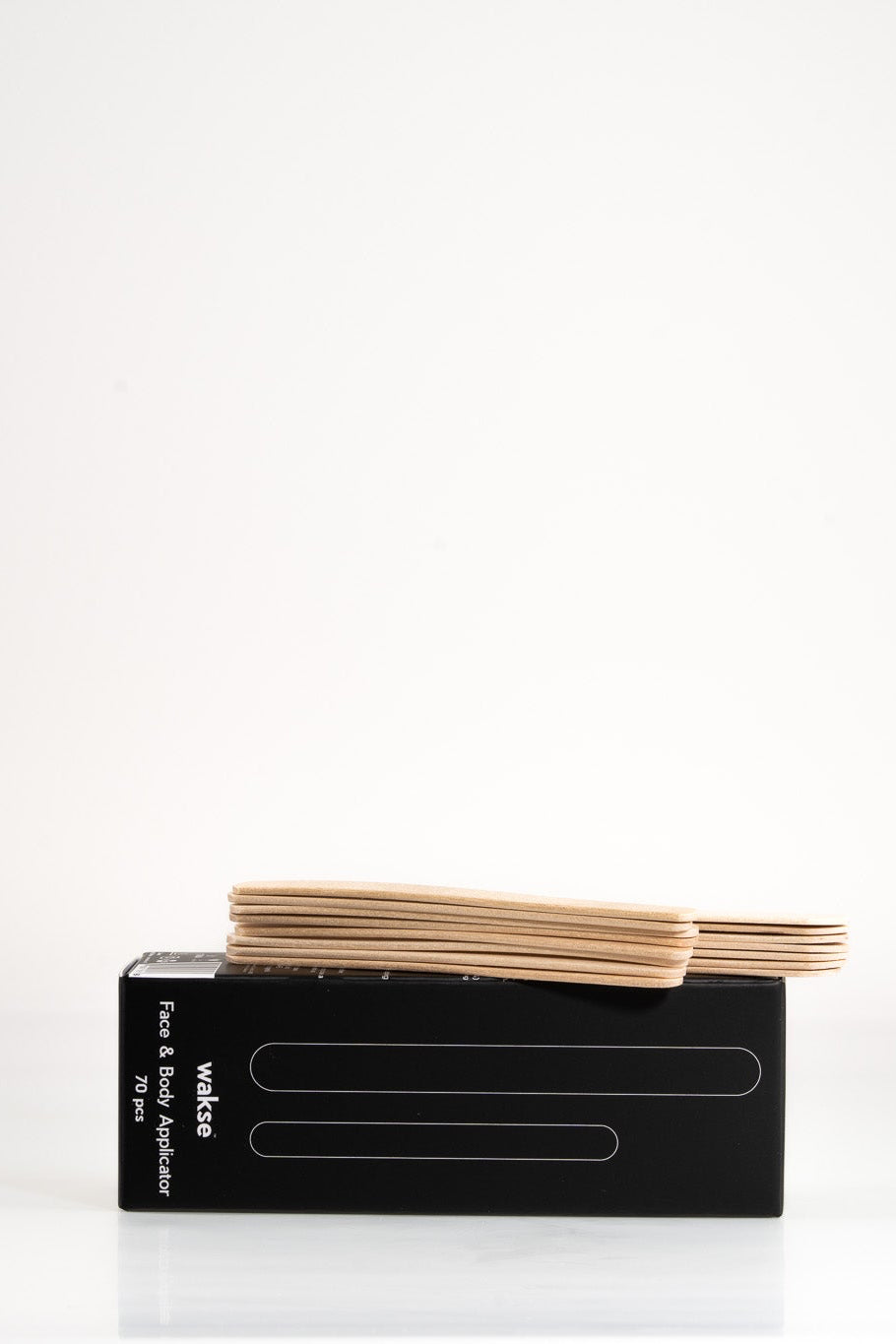Face and body wax applicator set with wooden sticks on black My Store packaging box