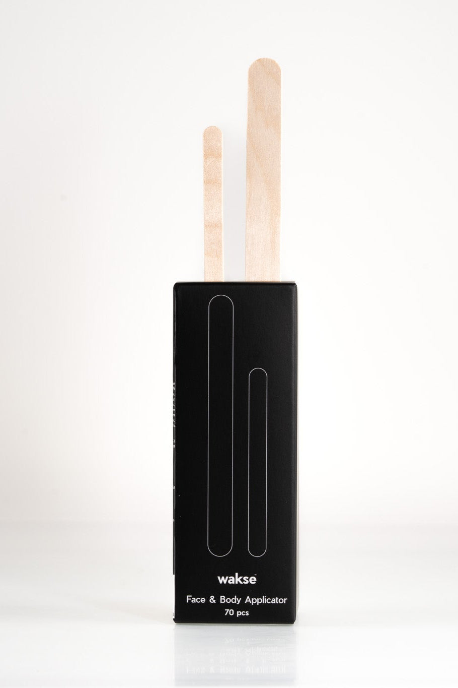 Face and body wax applicator set with wooden sticks in black packaging for easy waxing application